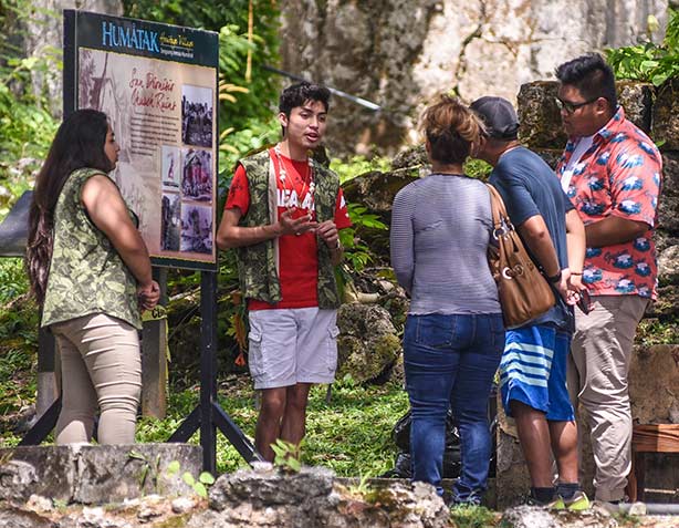 Gabriella Topasna and Tyler Aguon explain San Dionisio’s history to visitors